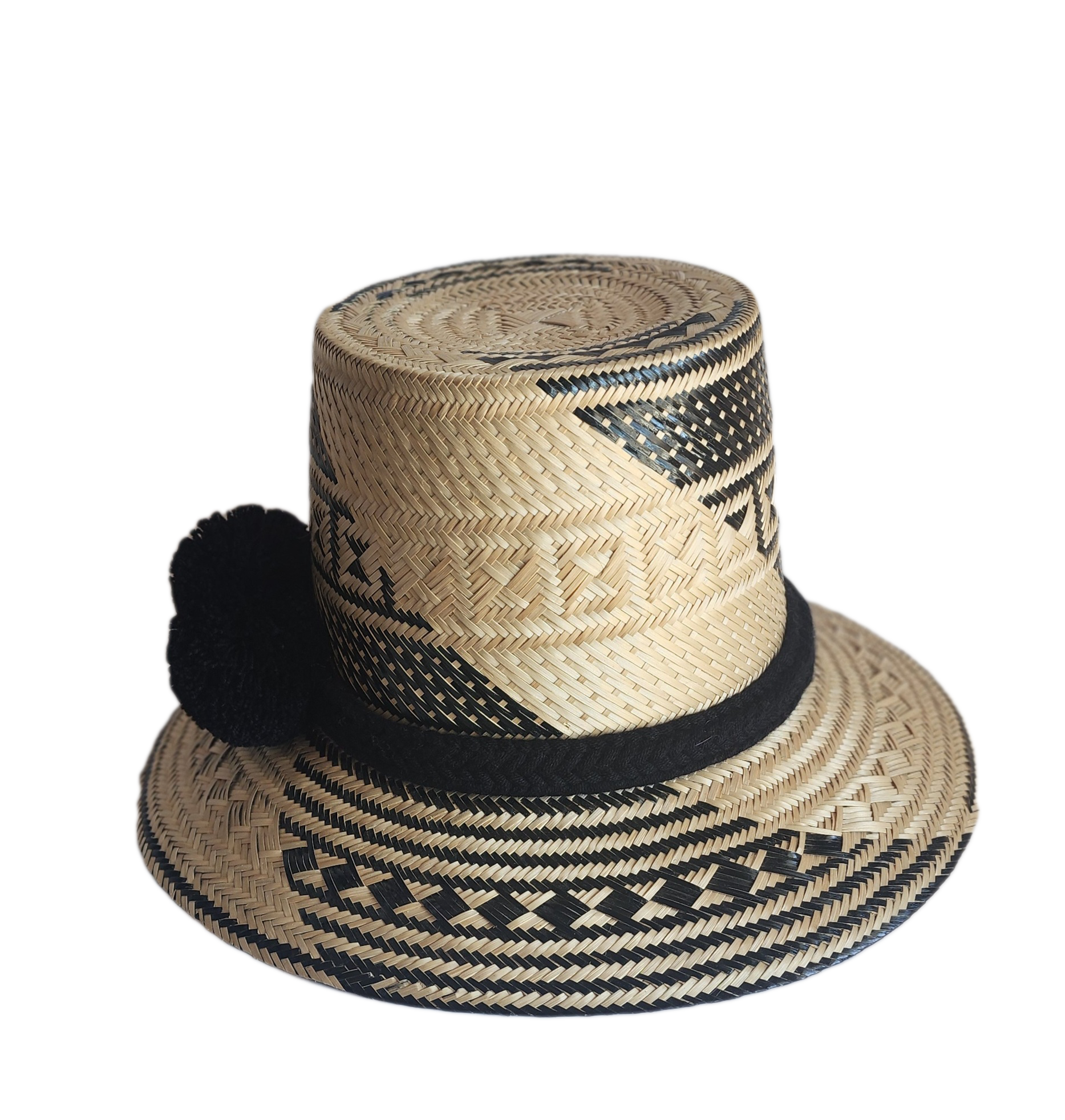 "Colorful handmade Wayuu hat crafted from Iraca palm fibers with culturally significant pompoms, offering sun protection and 