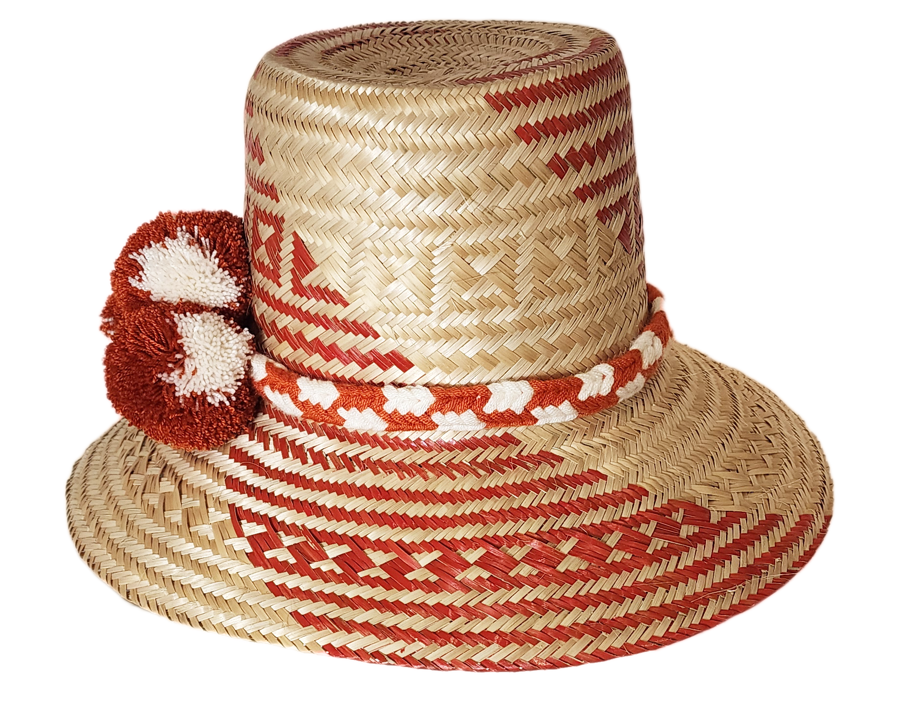 "Colorful handmade Wayuu hat crafted from Iraca palm fibers with significant cultural pompoms, offering versatile styling for