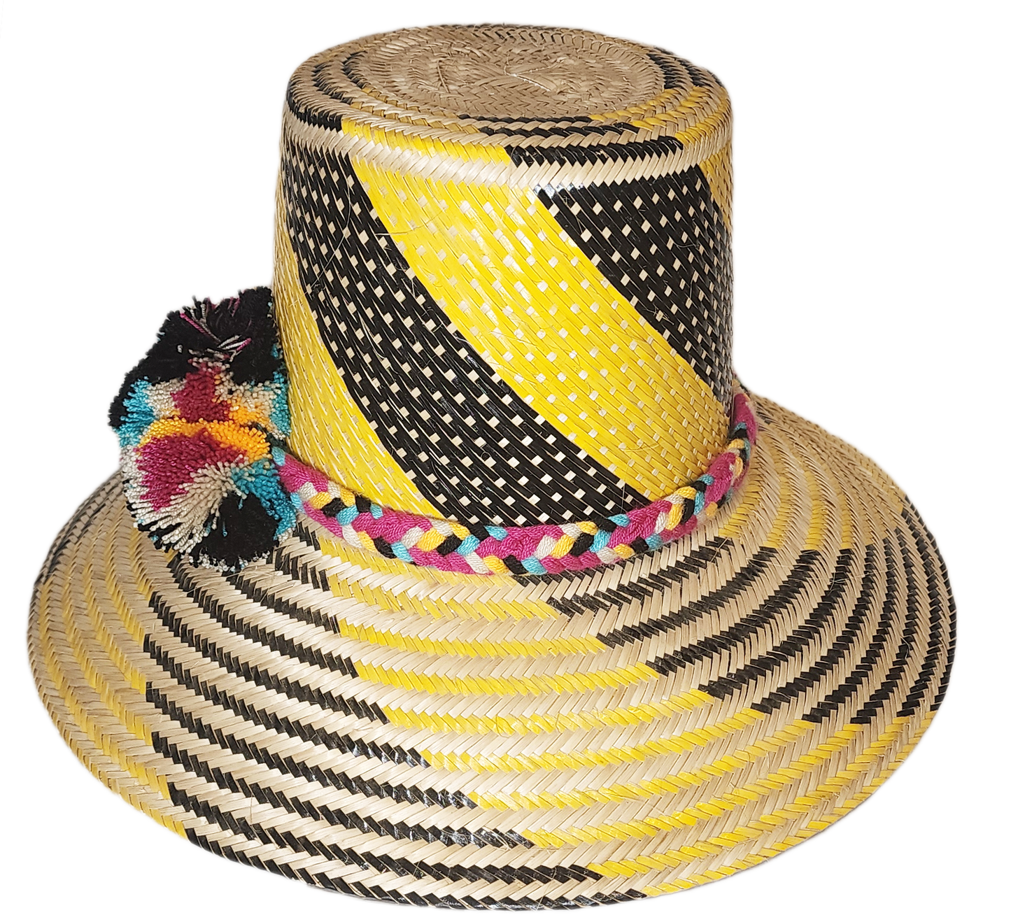 "Colorful handmade Wayuu hat crafted from Iraca palm fibers with decorative pompoms, showcasing vibrant Wayuu cultural design