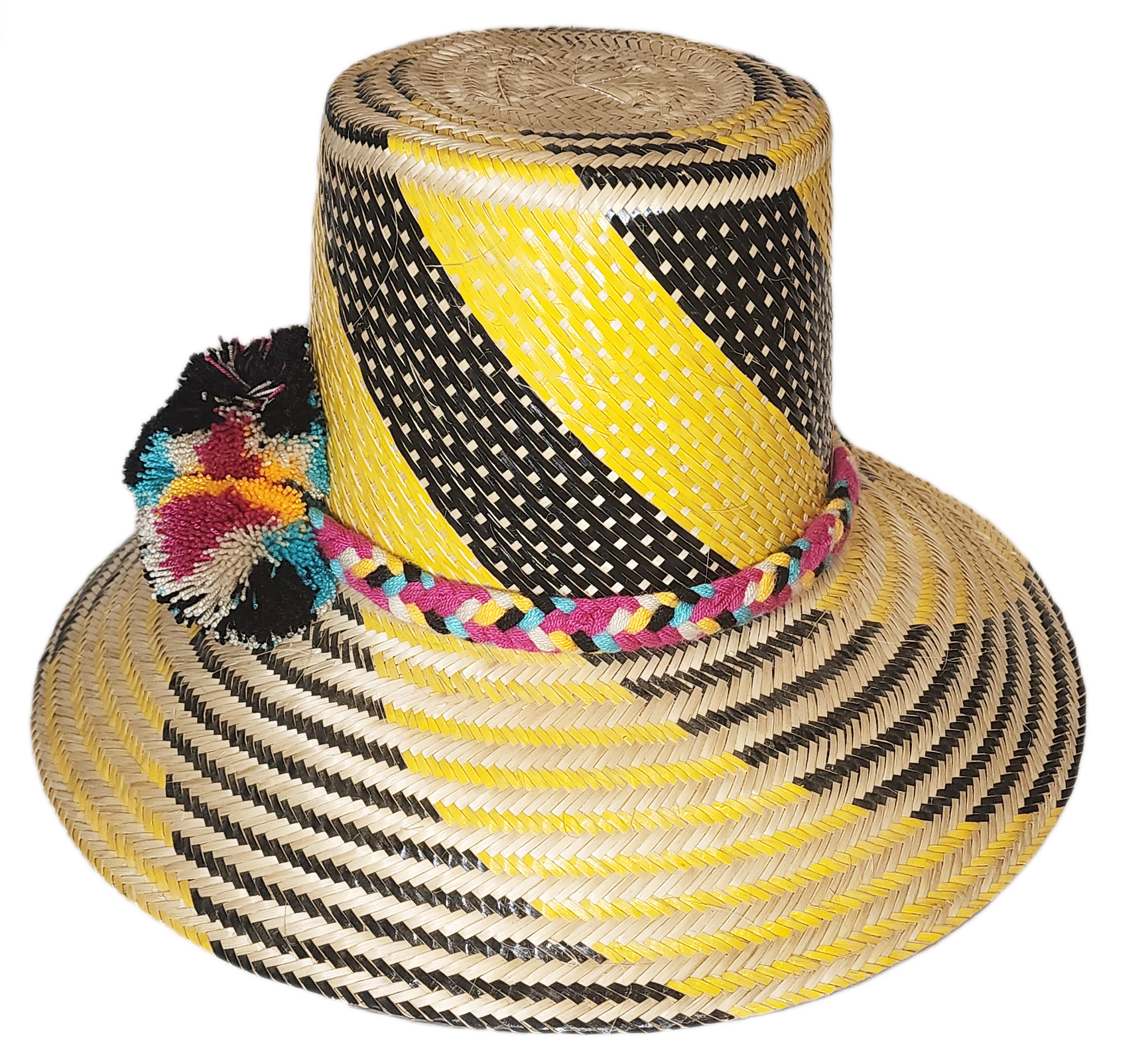 "Colorful handmade Wayuu hat crafted from Iraca palm fibers with decorative pompoms, showcasing vibrant Wayuu cultural design