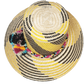 "Colorful handmade Wayuu hat crafted from Iraca palm fibers with decorative pompoms, showcasing vibrant Wayuu cultural design