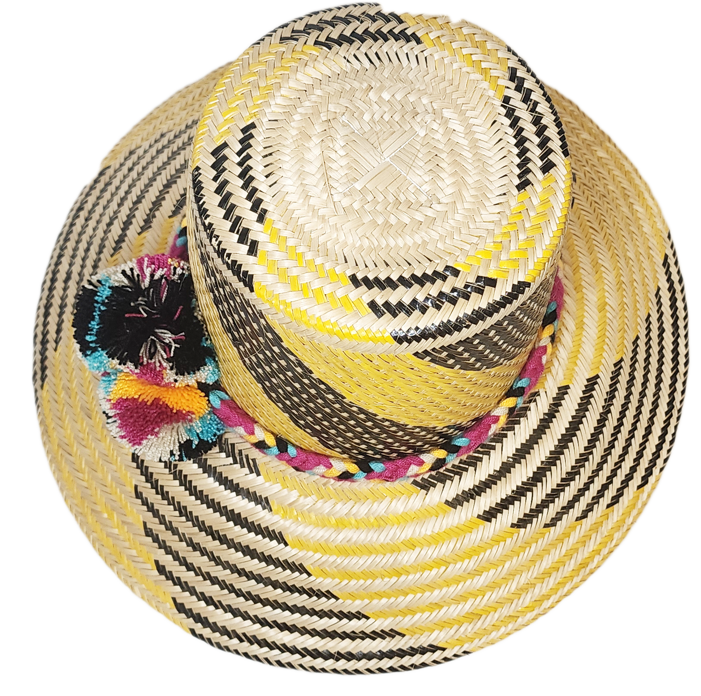 "Colorful handmade Wayuu hat crafted from Iraca palm fibers with decorative pompoms, showcasing vibrant Wayuu cultural design