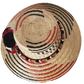 "Colorful handmade Wayuu hat crafted from Iraca palm fibers with distinctive pompoms, offering versatile style and cultural s