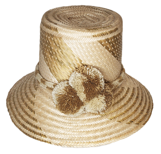 "Colorful handmade Wayuu hat from Iraca palm, adorned with cultural pompoms, adjustable for various styles and sizes."