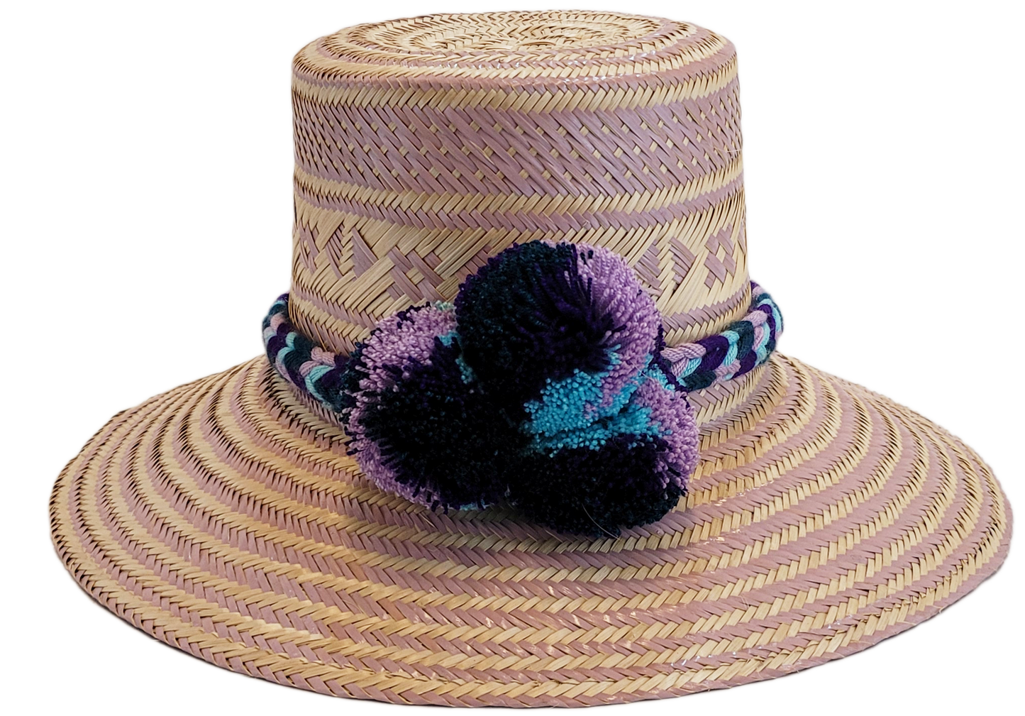 "Colorful handmade Wayuu hat from Iraca palm, adorned with cultural pompoms, adjustable for any head size, supports Wayuu chi