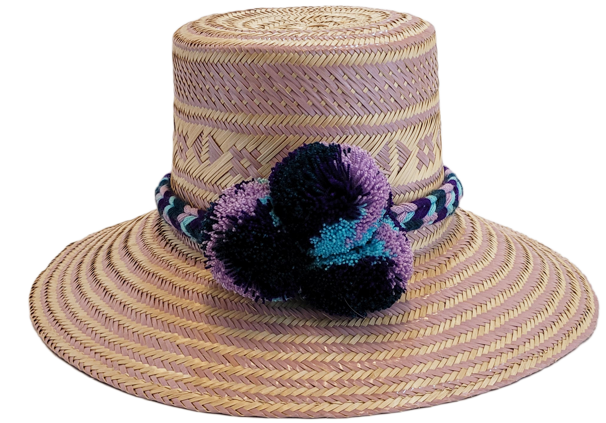 "Colorful handmade Wayuu hat from Iraca palm, adorned with cultural pompoms, adjustable for any head size, supports Wayuu chi