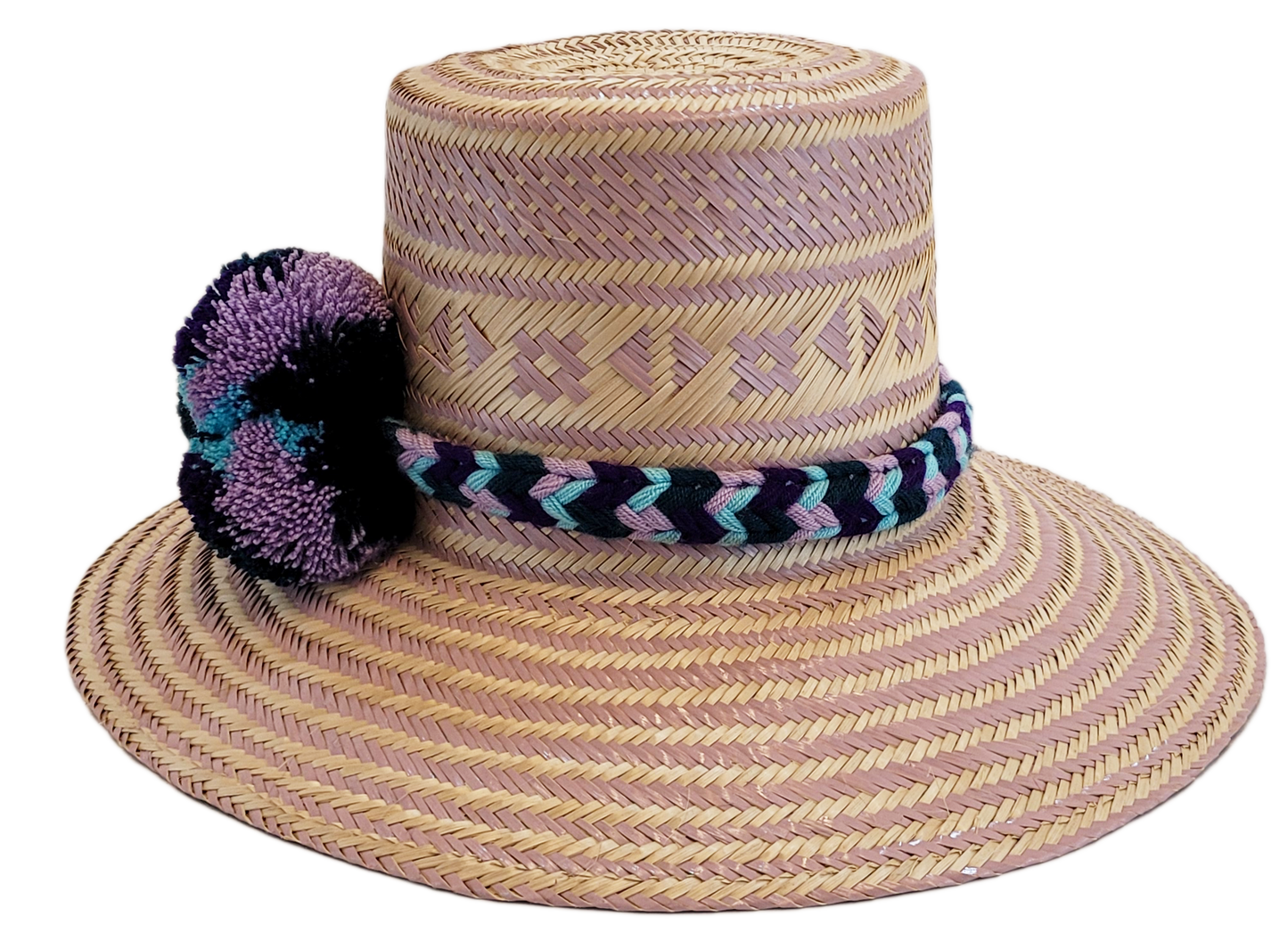 "Colorful handmade Wayuu hat from Iraca palm, adorned with cultural pompoms, adjustable for any head size, supports Wayuu chi