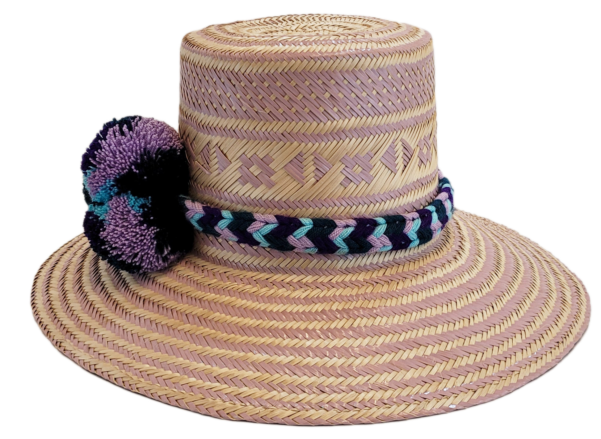 "Colorful handmade Wayuu hat from Iraca palm, adorned with cultural pompoms, adjustable for any head size, supports Wayuu chi