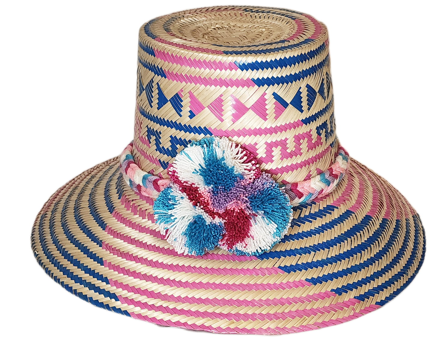 "Colorful handmade Wayuu hat from Iraca palm, adorned with significant pompoms, offering style and sun protection."