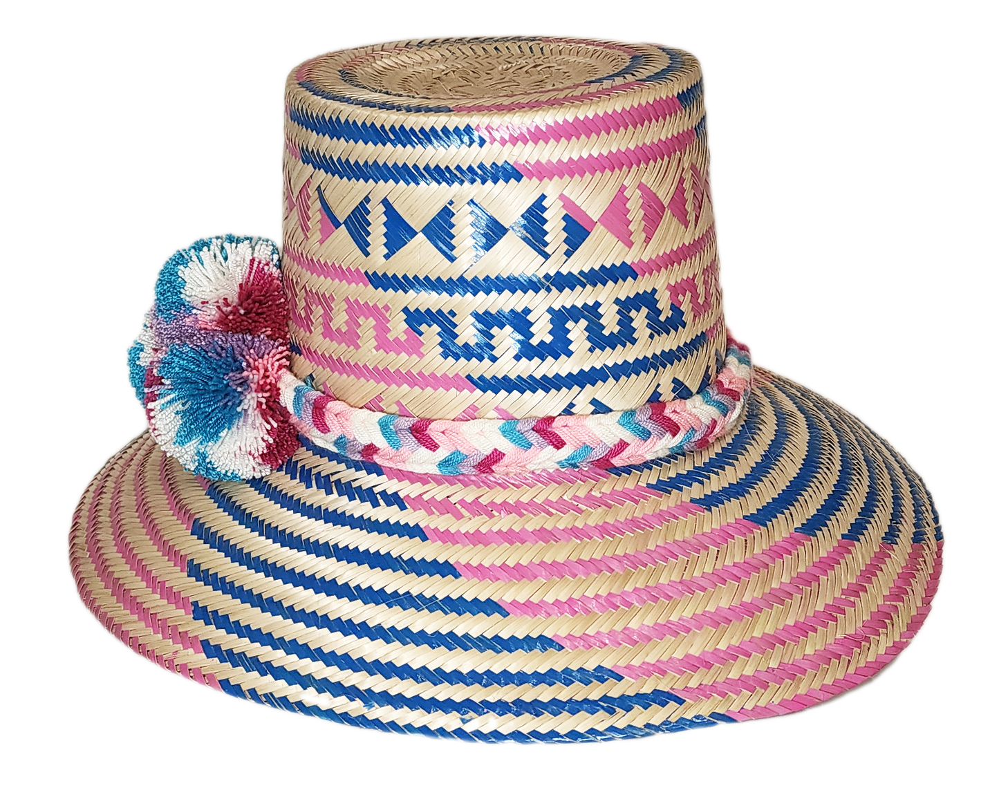 "Colorful handmade Wayuu hat from Iraca palm, adorned with significant pompoms, offering style and sun protection."