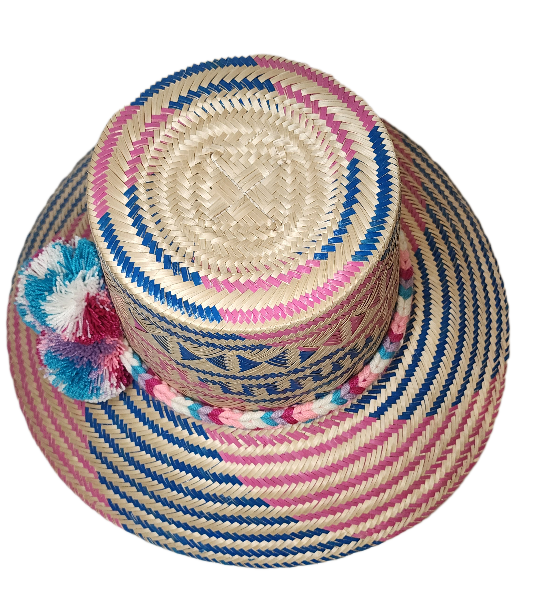 "Colorful handmade Wayuu hat from Iraca palm, adorned with significant pompoms, offering style and sun protection."