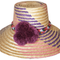 "Colorful handmade Wayuu hat from Iraca palm fibers, adorned with symbolic pompoms, offering sun protection and adjustable fi