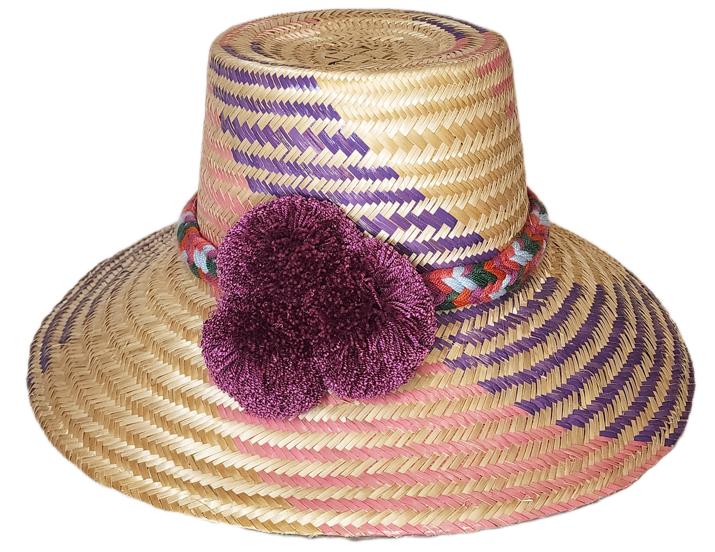 "Colorful handmade Wayuu hat from Iraca palm fibers, adorned with symbolic pompoms, offering sun protection and adjustable fi