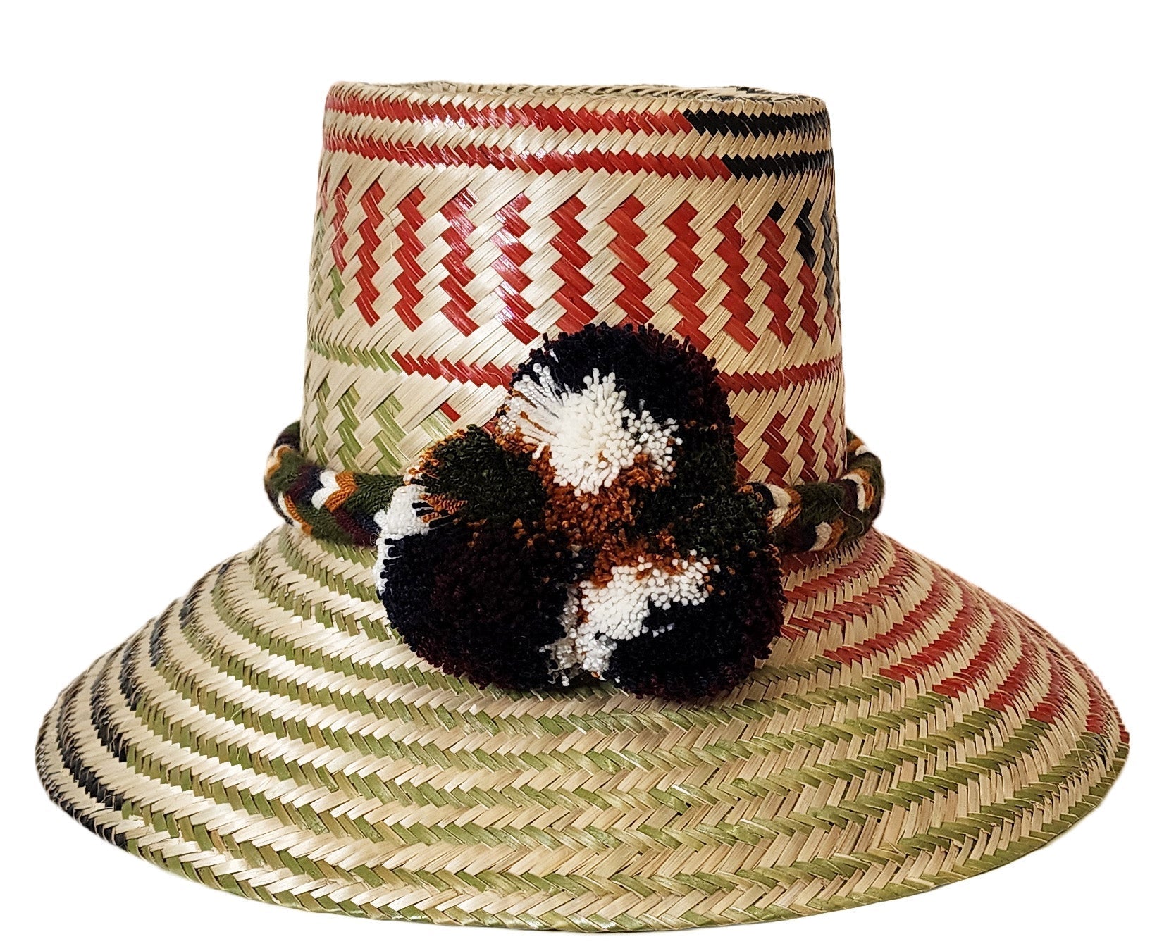 "Colorful Handmade Wayuu Hat from Iraca palm fibers, adorned with culturally significant pompoms, crafted by Wuitusu artisans