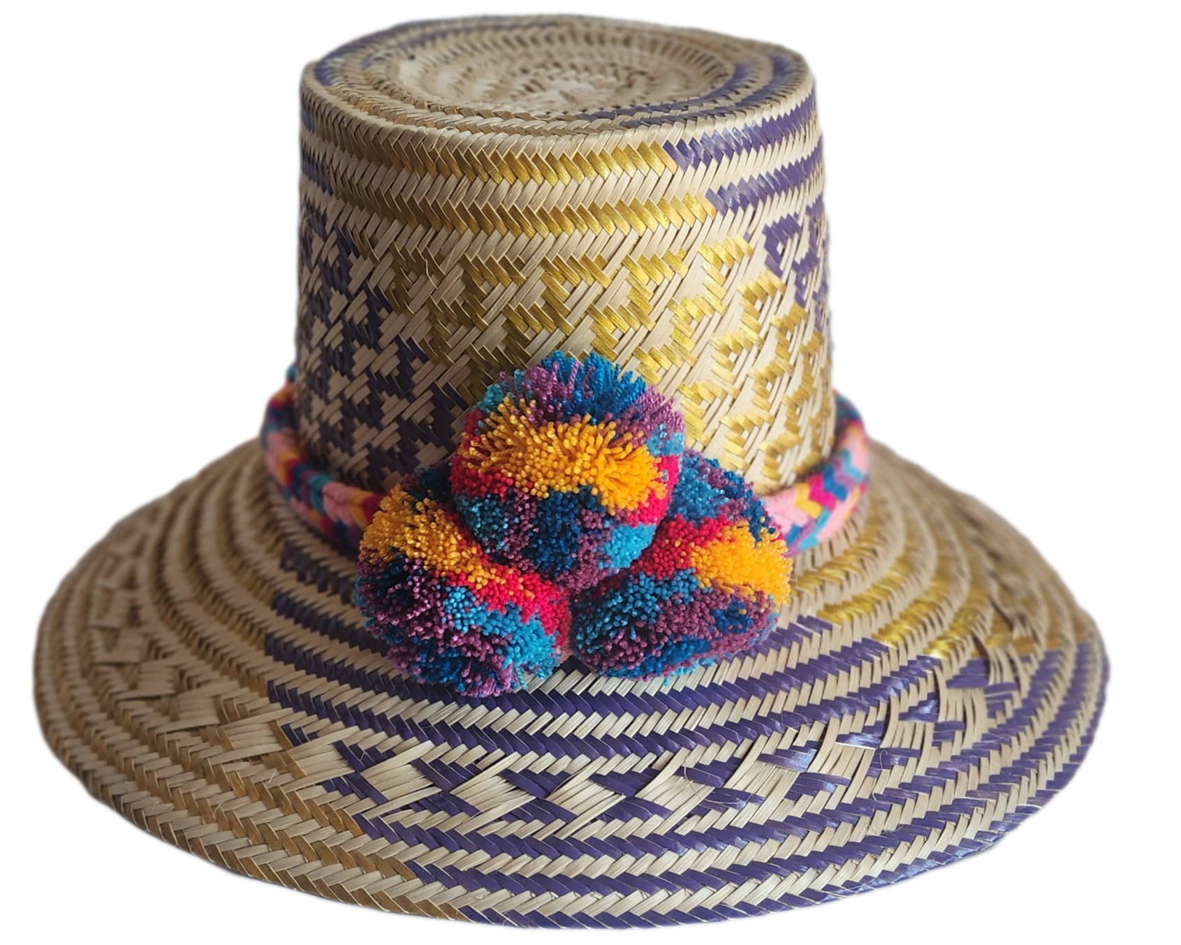"Colorful handmade Wayuu hat from Iraca palm fibers, adorned with culturally significant pompoms, showcasing unique artisan c