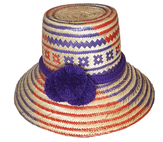 "Colorful, handmade Wayuu hat from Iraca palm fibers, adorned with culturally significant pompoms, showcasing artisan craftsm