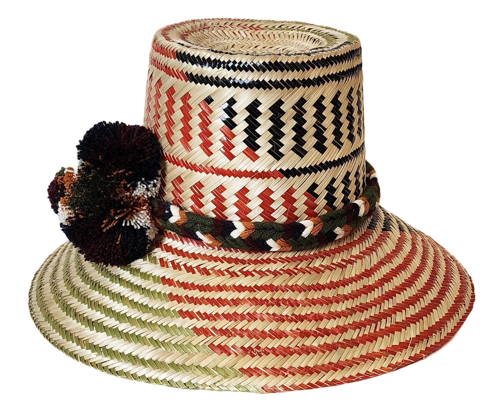 "Colorful Handmade Wayuu Hat from Iraca palm fibers, adorned with culturally significant pompoms, crafted by Wuitusu artisans