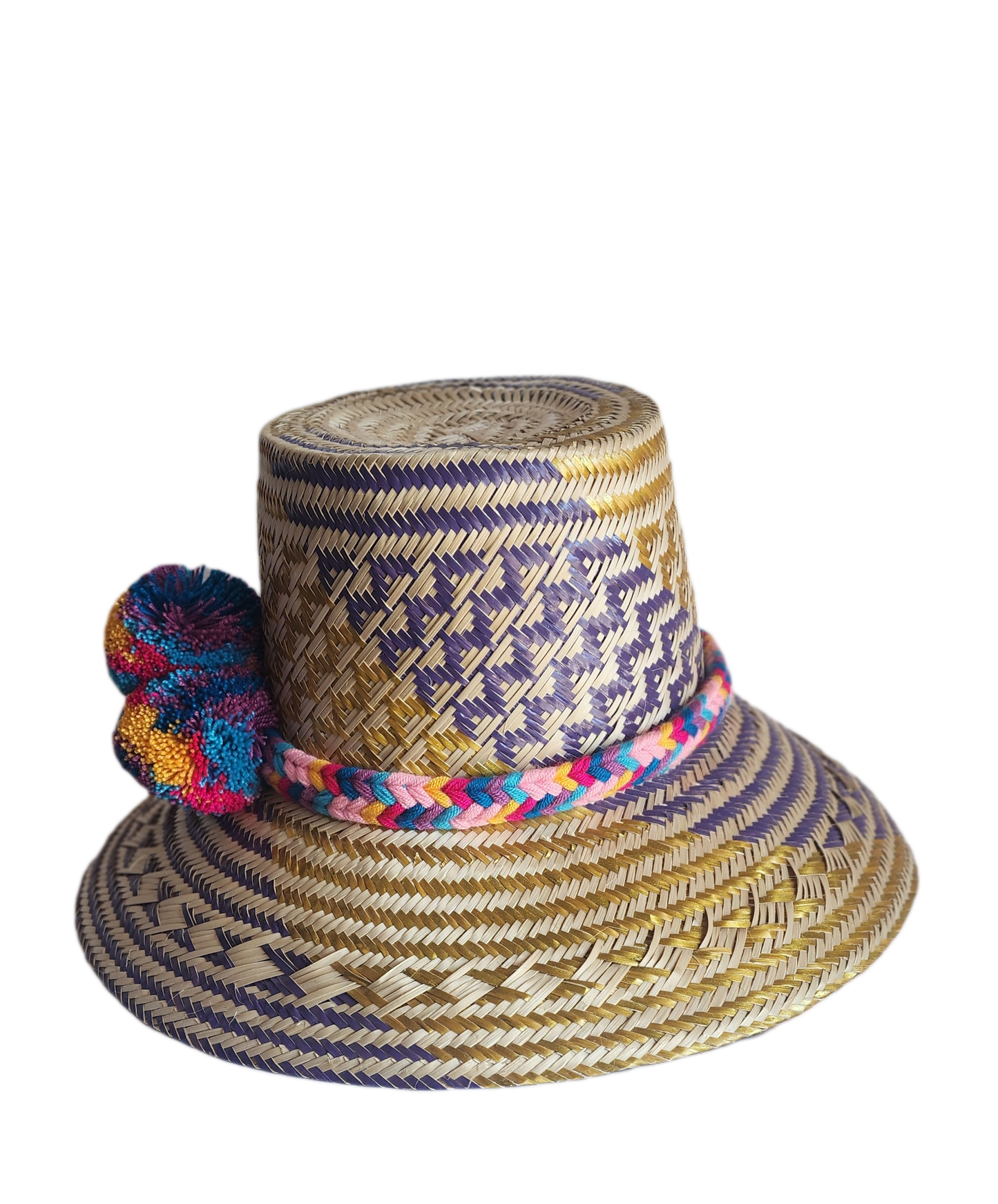 "Colorful handmade Wayuu hat from Iraca palm fibers, adorned with culturally significant pompoms, showcasing unique artisan c
