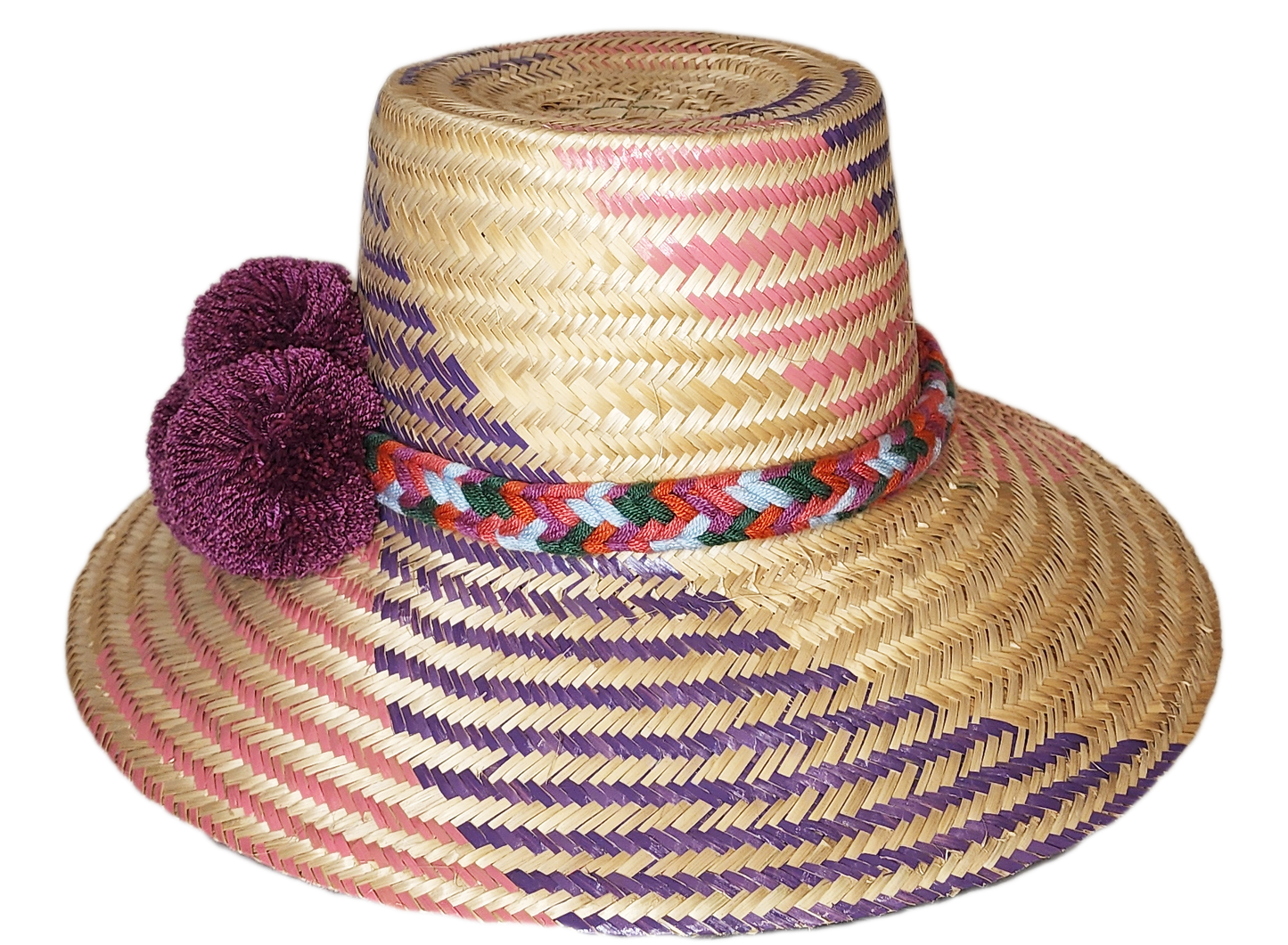 "Colorful handmade Wayuu hat from Iraca palm fibers, adorned with symbolic pompoms, offering sun protection and adjustable fi