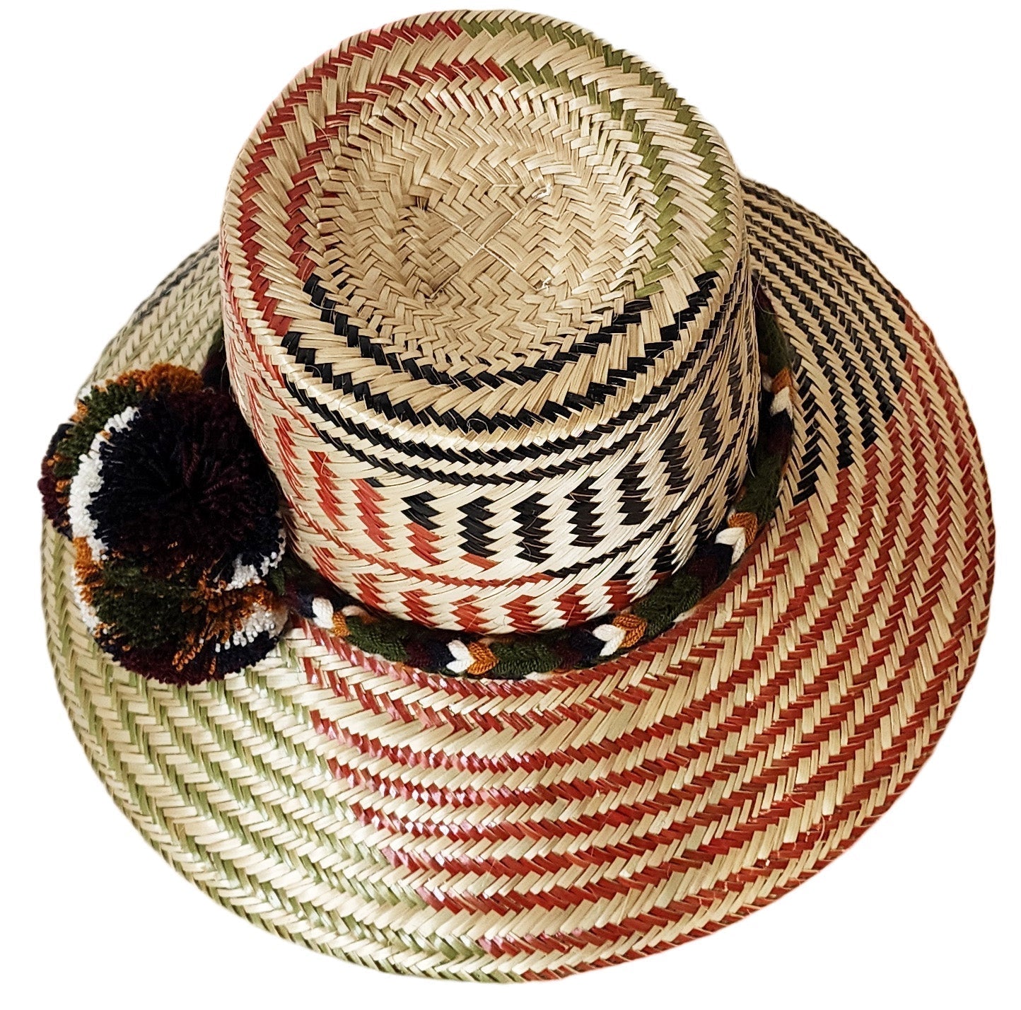 "Colorful Handmade Wayuu Hat from Iraca palm fibers, adorned with culturally significant pompoms, crafted by Wuitusu artisans