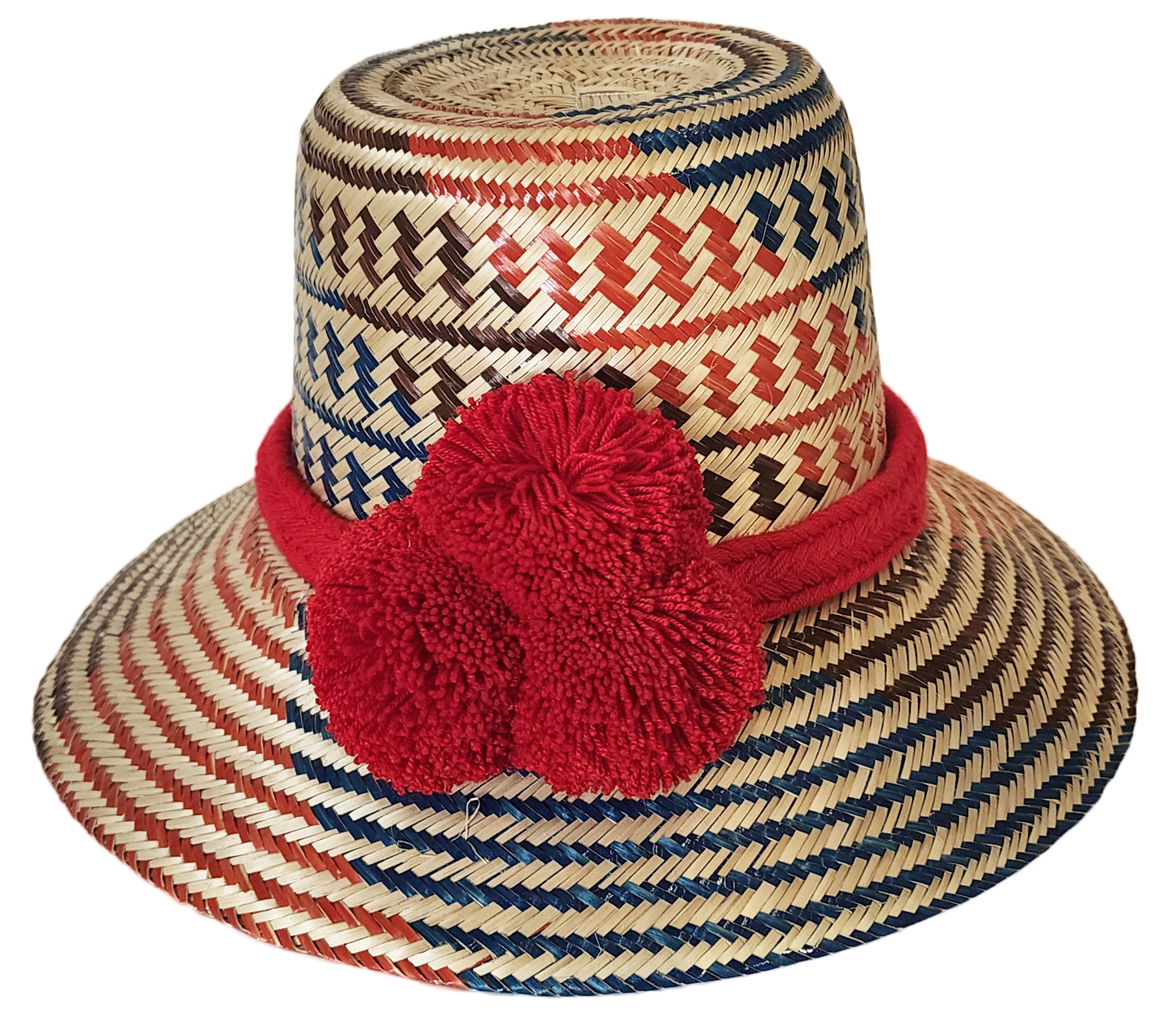 "Colorful handmade Wayuu hat from Wuitusu, crafted with Iraca palm fibers, adorned with culturally significant pompoms."