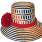 "Colorful handmade Wayuu hat from Wuitusu, crafted with Iraca palm fibers, adorned with culturally significant pompoms."