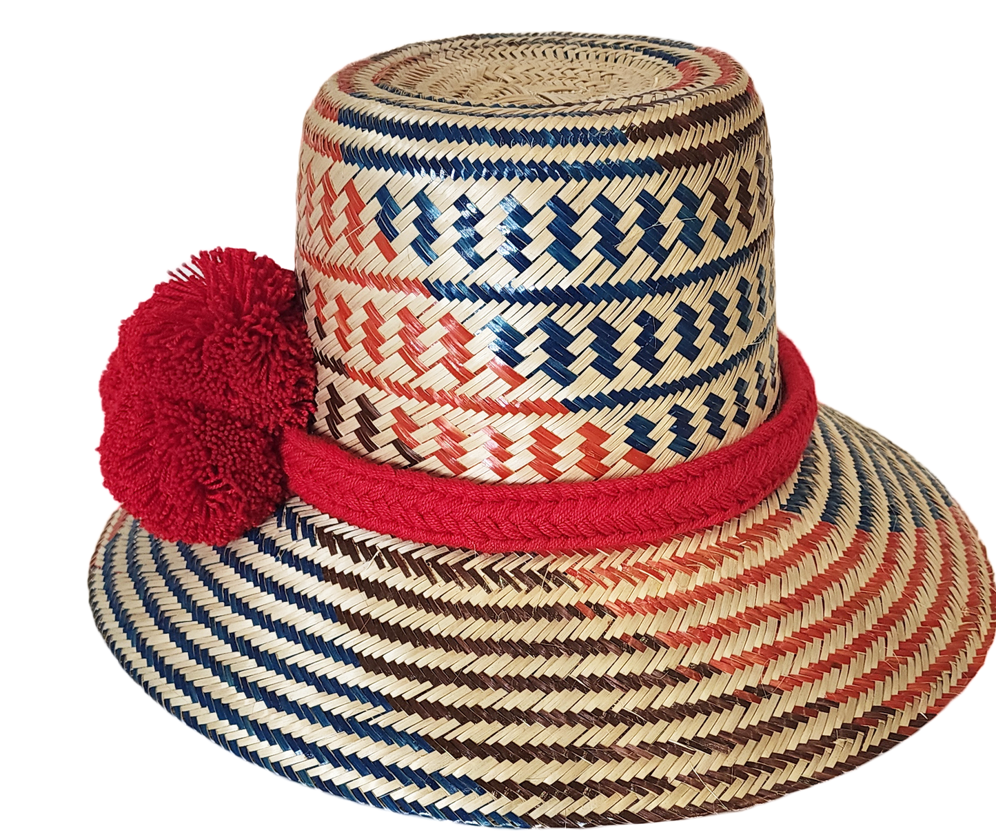 "Colorful handmade Wayuu hat from Wuitusu, crafted with Iraca palm fibers, adorned with culturally significant pompoms."