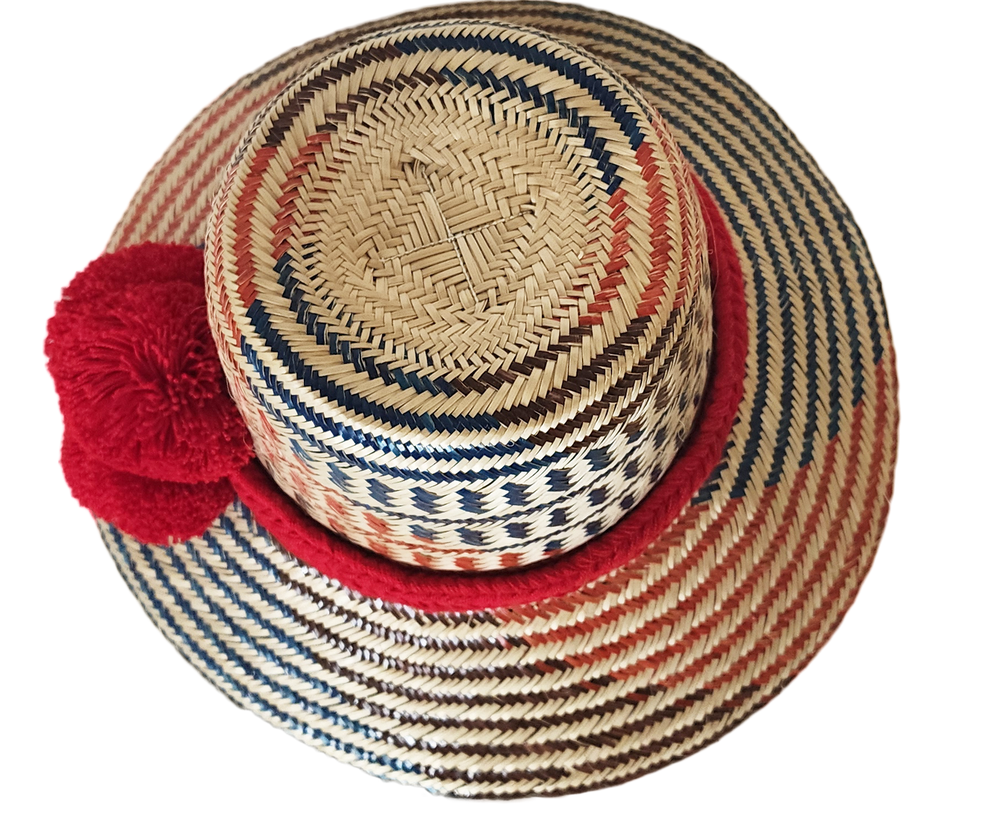 "Colorful handmade Wayuu hat from Wuitusu, crafted with Iraca palm fibers, adorned with culturally significant pompoms."