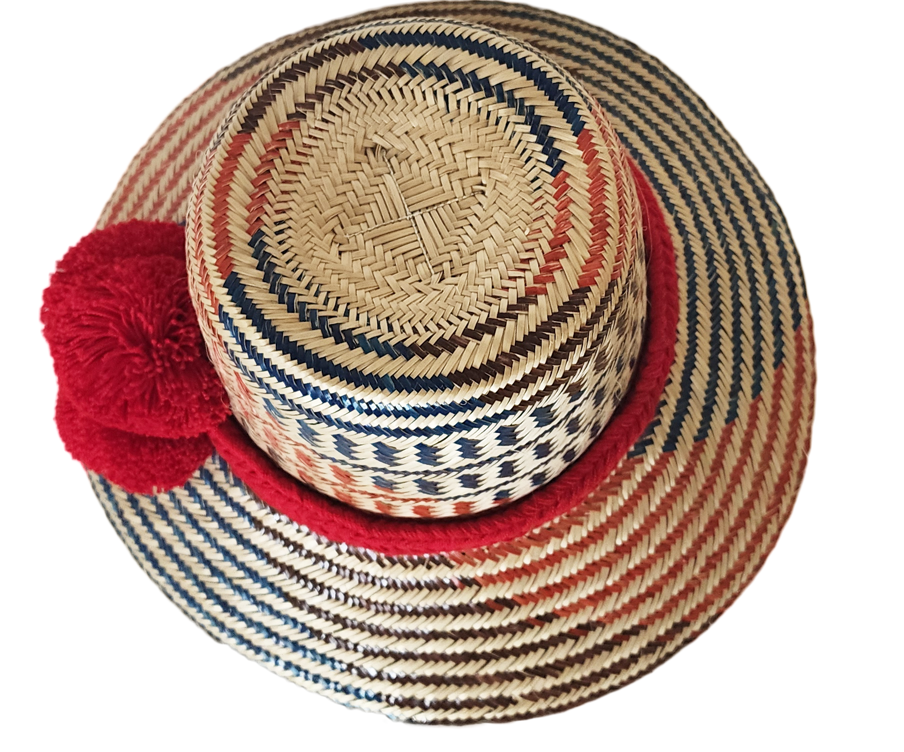 "Colorful handmade Wayuu hat from Wuitusu, crafted with Iraca palm fibers, adorned with culturally significant pompoms."