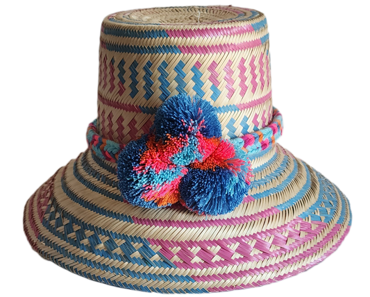 "Colorful handmade Wayuu hat, handwoven from Iraca palm fibers, adorned with culturally significant pompoms, adjustable fit."