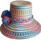 "Colorful handmade Wayuu hat, handwoven from Iraca palm fibers, adorned with culturally significant pompoms, adjustable fit."