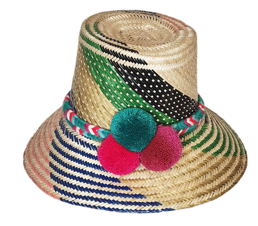 "Colorful handmade Wayuu hat made from Iraca palm fibers, adjustable and adorned with significant pompoms."
