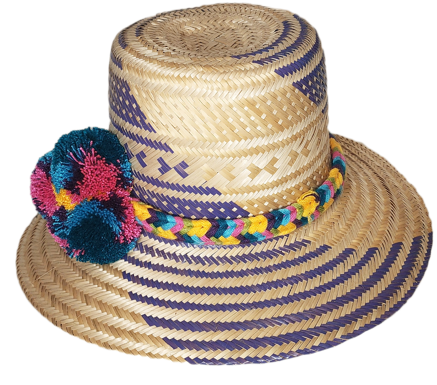 "Colorful handmade Wayuu hat with decorative pompoms, crafted from Iraca palm fibers by Wuitusu artisans."