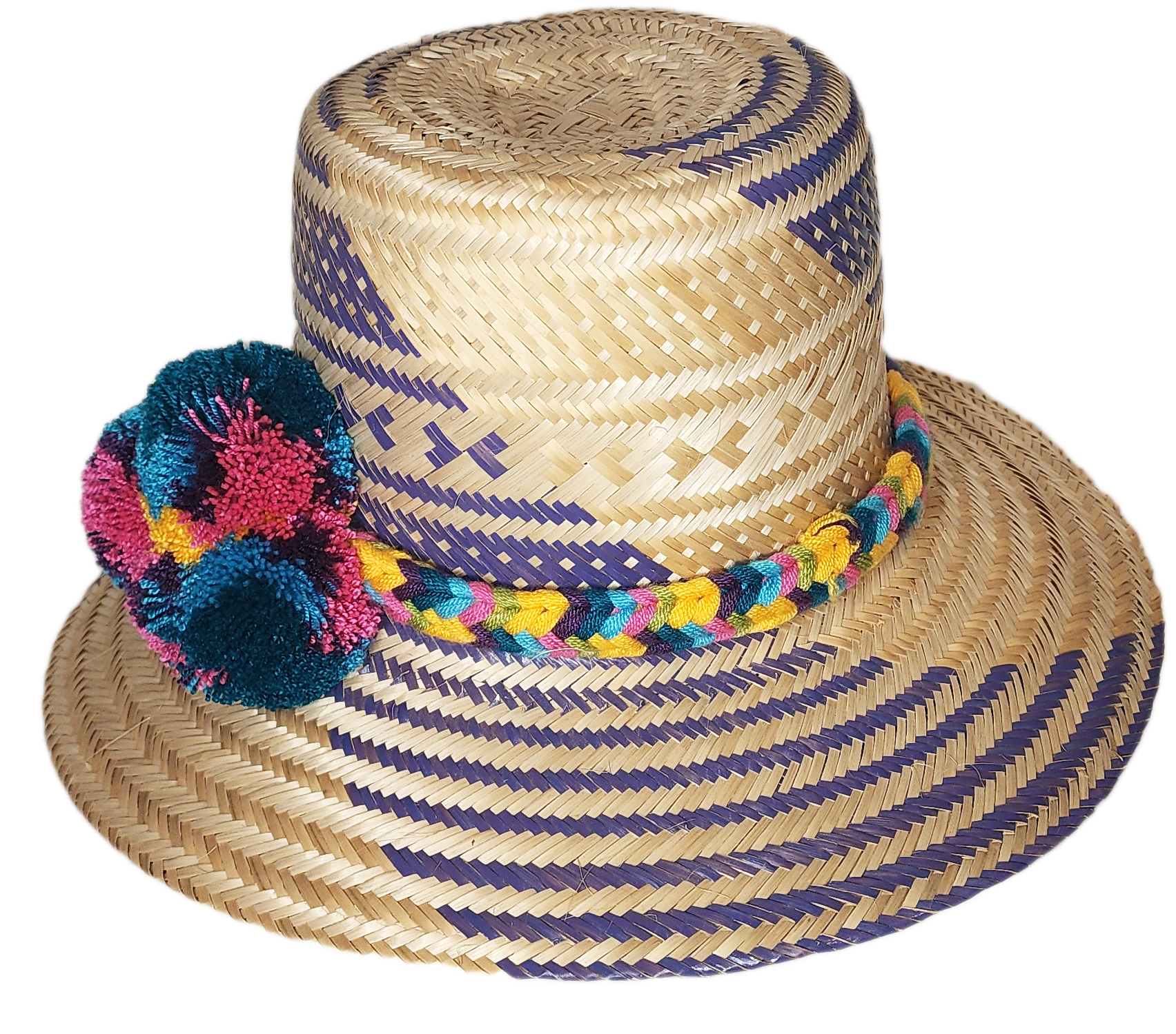"Colorful handmade Wayuu hat with decorative pompoms, crafted from Iraca palm fibers by Wuitusu artisans."