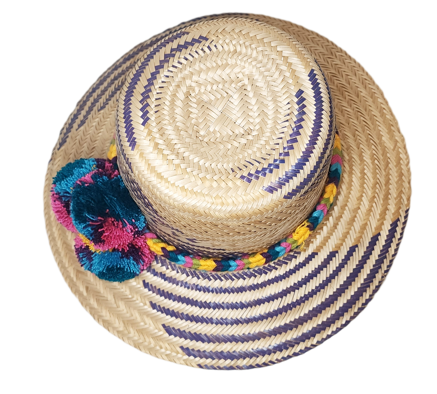 "Colorful handmade Wayuu hat with decorative pompoms, crafted from Iraca palm fibers by Wuitusu artisans."