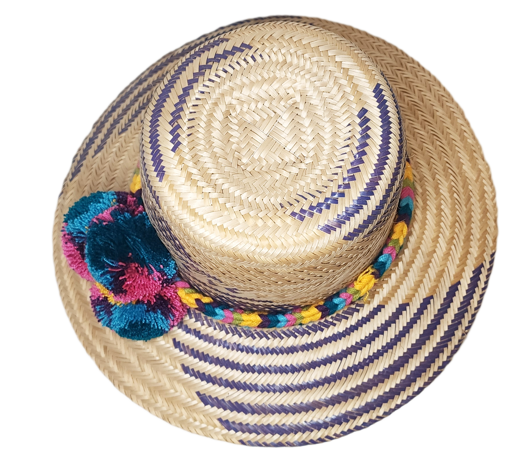 "Colorful handmade Wayuu hat with decorative pompoms, crafted from Iraca palm fibers by Wuitusu artisans."