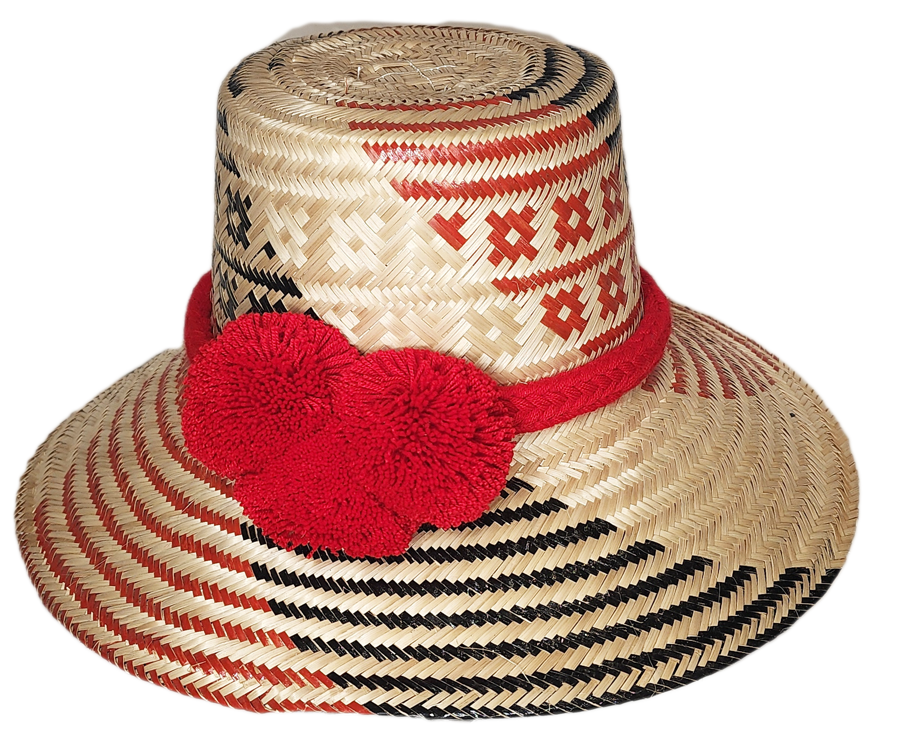 Handmade Wayuu straw hat with bold red pompoms and black-red weave

