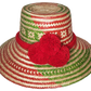 "Colorful handmade Wayuu hat woven from Iraca palm fibers, adorned with significant pompoms, adjustable for style and fit."