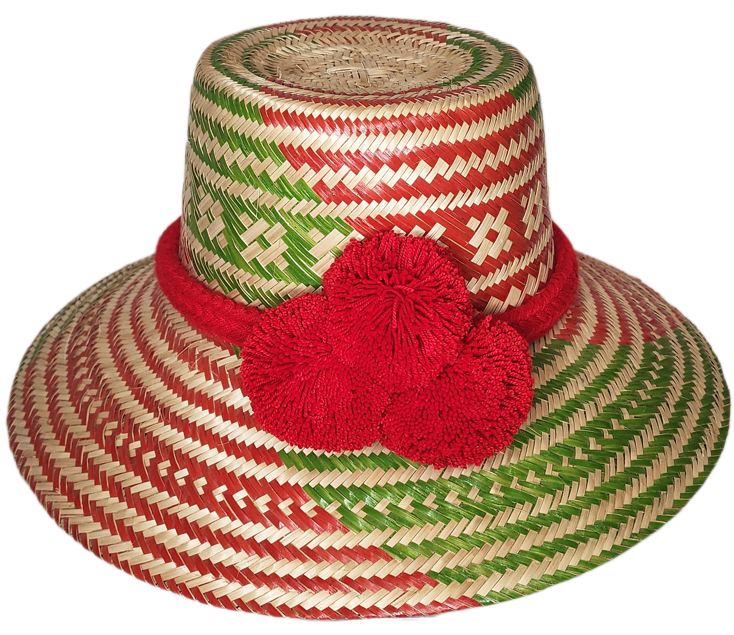"Colorful handmade Wayuu hat woven from Iraca palm fibers, adorned with significant pompoms, adjustable for style and fit."