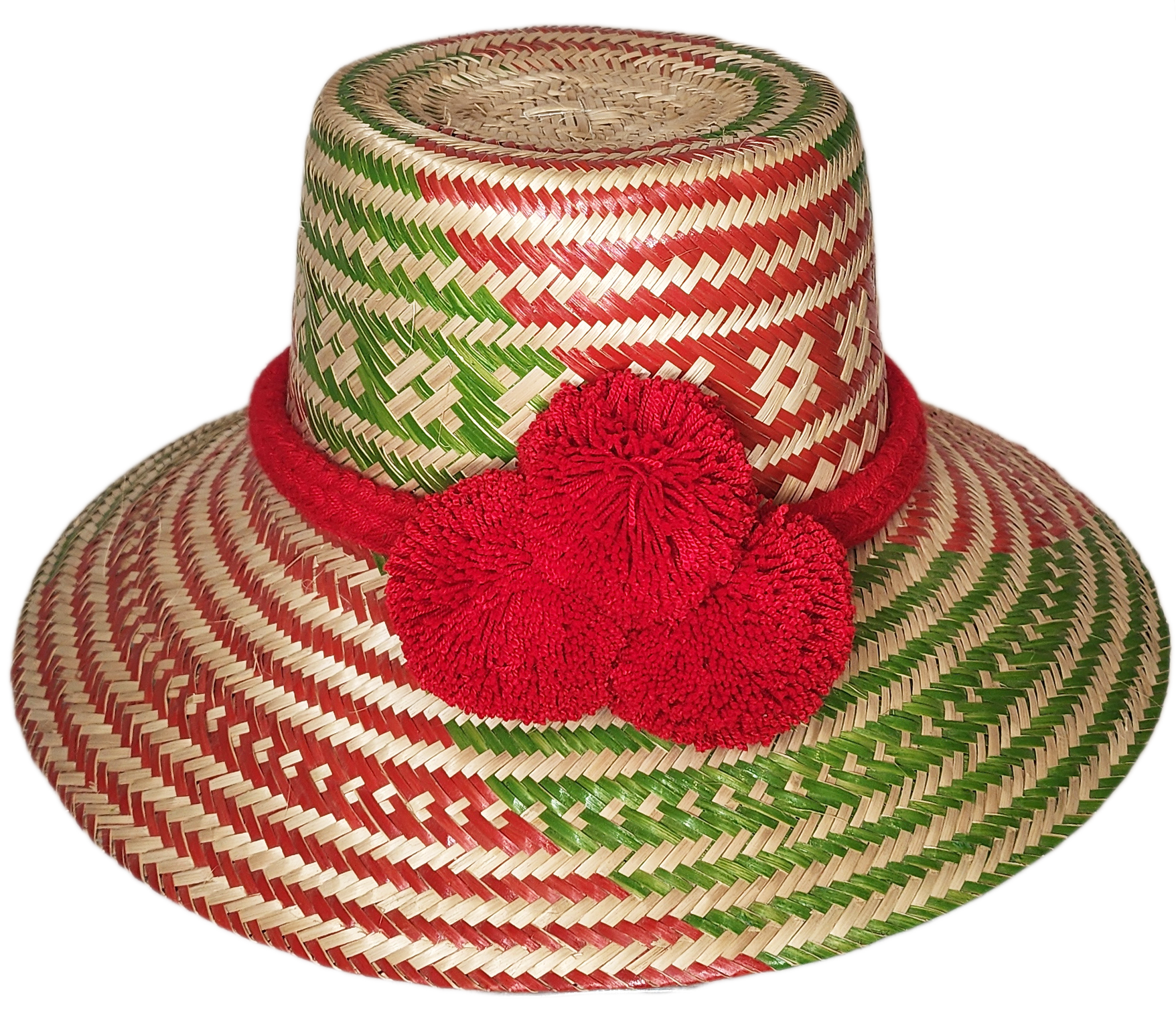 "Colorful handmade Wayuu hat woven from Iraca palm fibers, adorned with significant pompoms, adjustable for style and fit."