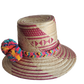 "Colorful handmade Wayuu hat woven from Iraca palm fibers, adorned with culturally significant pompoms, offering adjustable f