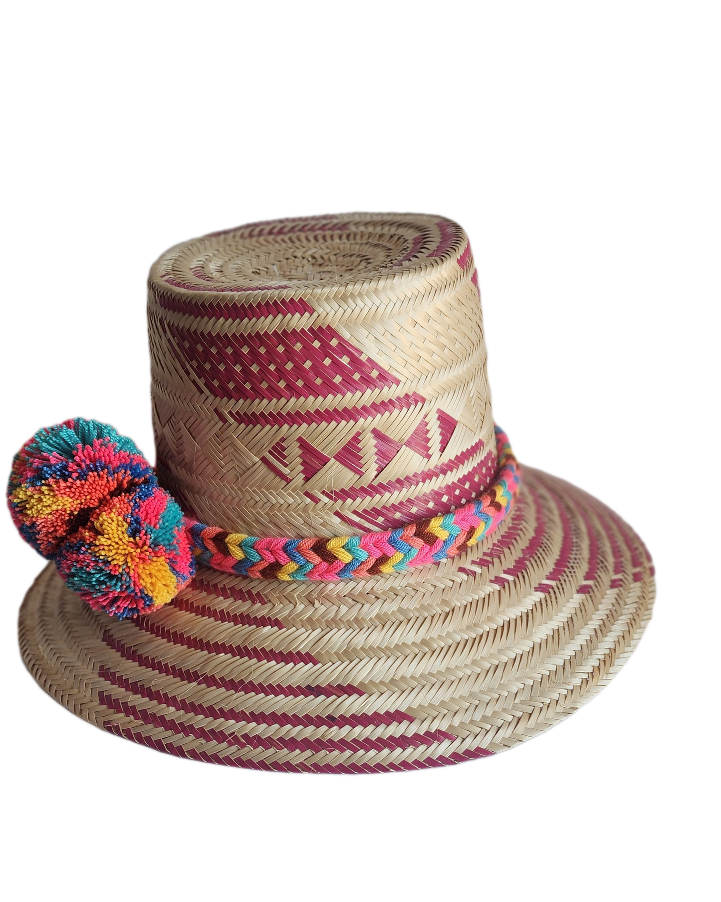 "Colorful handmade Wayuu hat woven from Iraca palm fibers, adorned with culturally significant pompoms, offering adjustable f