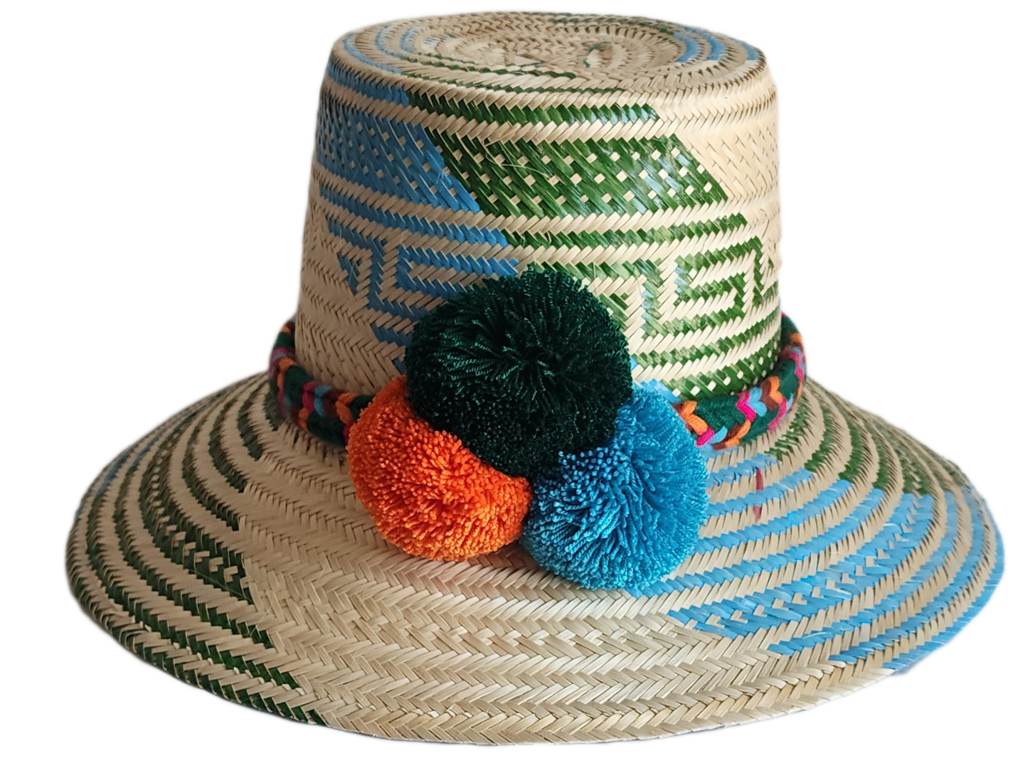 "Colorful handmade Wayuu hat woven from Iraca palm fibers, featuring decorative pompoms and offering adjustable fit."