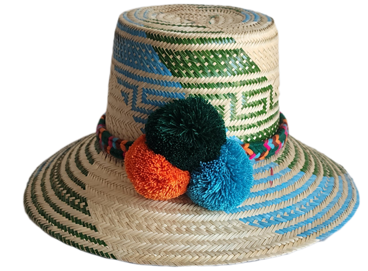 "Colorful handmade Wayuu hat woven from Iraca palm fibers, featuring decorative pompoms and offering adjustable fit."