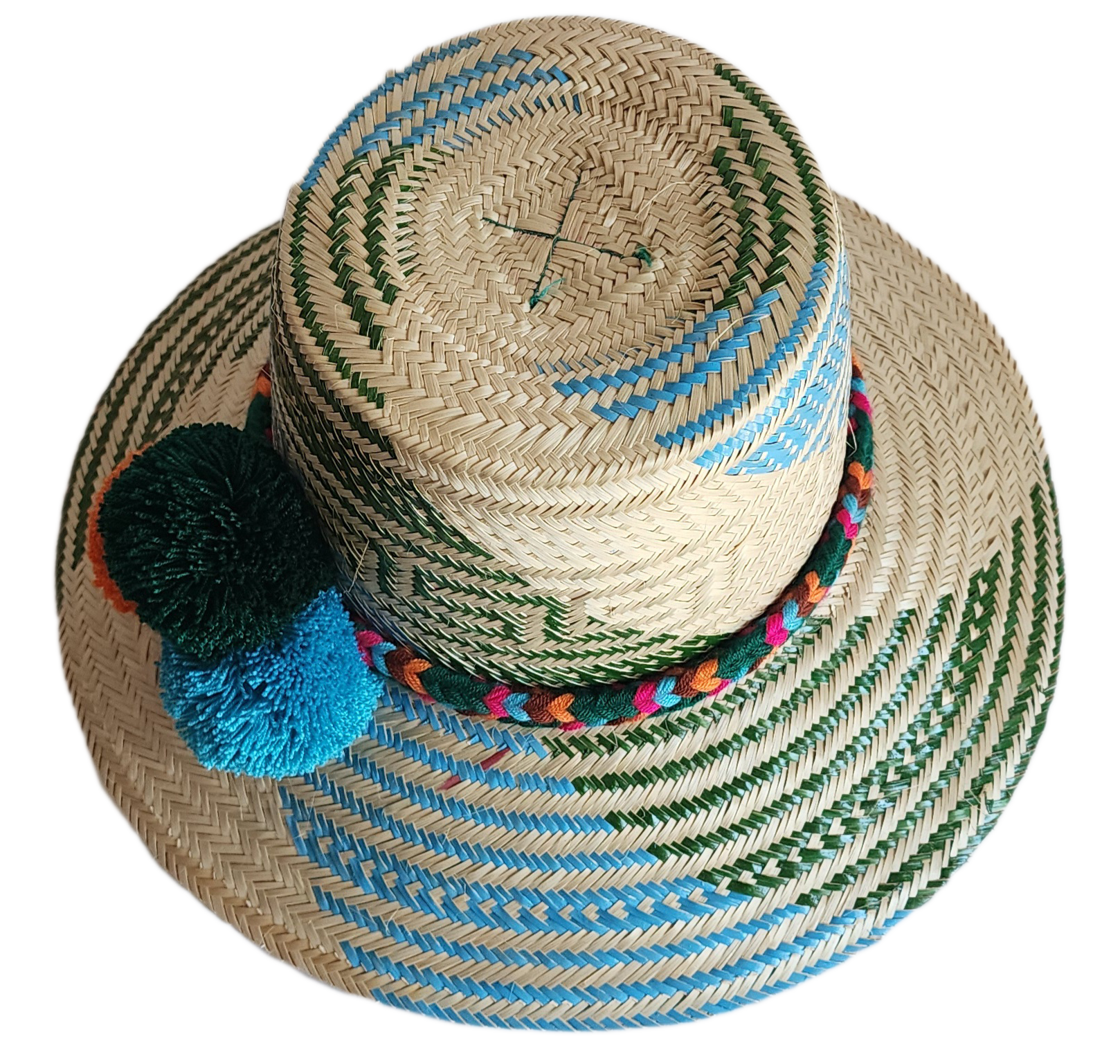 "Colorful handmade Wayuu hat woven from Iraca palm fibers, featuring decorative pompoms and offering adjustable fit."