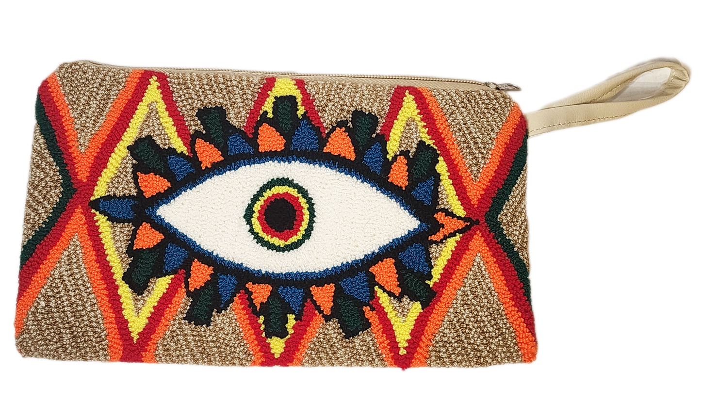 "Colorful handmade Wayuu Needle Punch Clutch with vibrant patterns and secure zip closure, showcasing traditional craftsmansh