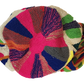 "Colorful handmade Wayuu punch needle crochet bag with adjustable straps, showcasing vibrant geometric patterns and craftsman