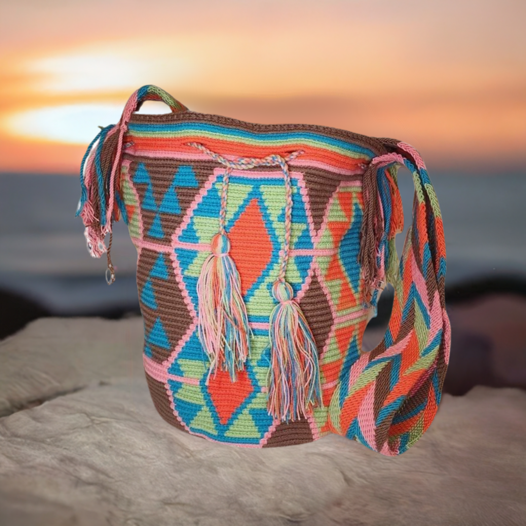 "Colorful handmade Wuitusu Crochet Wayuu Bag by Colombian artisans, featuring vibrant geometric patterns and a long, comforta