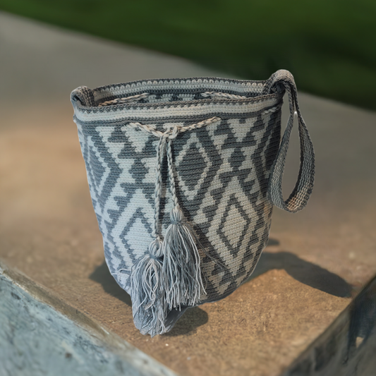 "Colorful handmade Wuitusu Wayuu crochet handbag, showcasing vibrant bohemian artistry and supporting Wayuu culture."