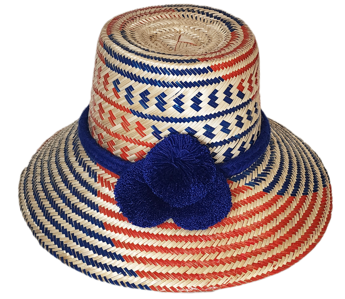 "Colorful handmade Wuitusu Wayuu hat crafted from Iraca palm fibers, adorned with symbolic pompoms, offering versatile stylin